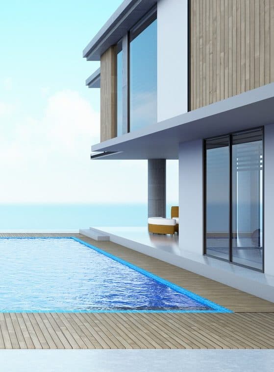 modern house outside pool infinity edge glass windows
